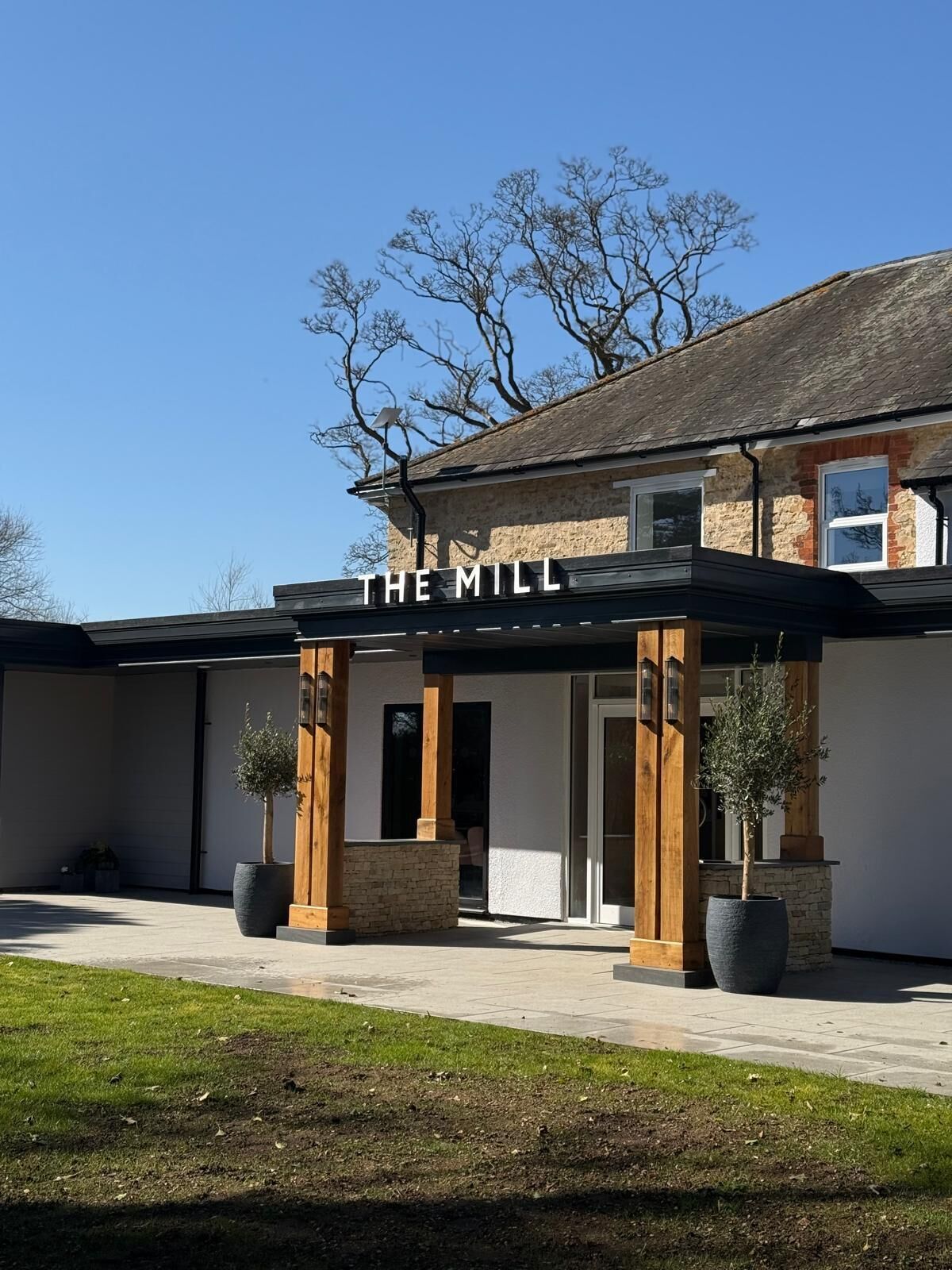 A building with a sign reading "THE MILL".