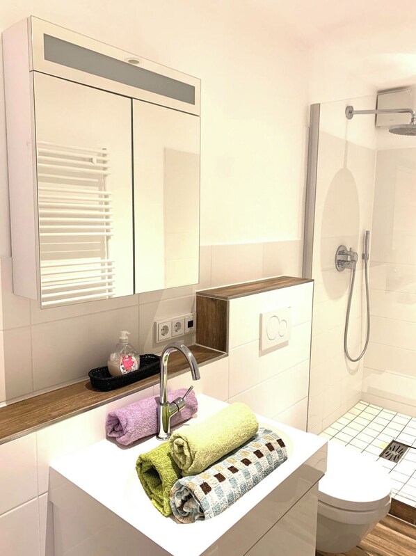 Hair dryer, towels, soap, toilet paper