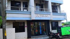 A building with a sign reading "UK PALACE". - DhamStay Hotel UK Palace Near Beach Puri (Puri)