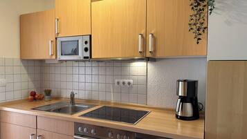 Microwave, stovetop, dishwasher, coffee/tea maker