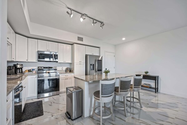 Fridge, microwave, oven, stovetop - Waterfront condo w/ pool, hot tub & sauna (Merritt Island)
