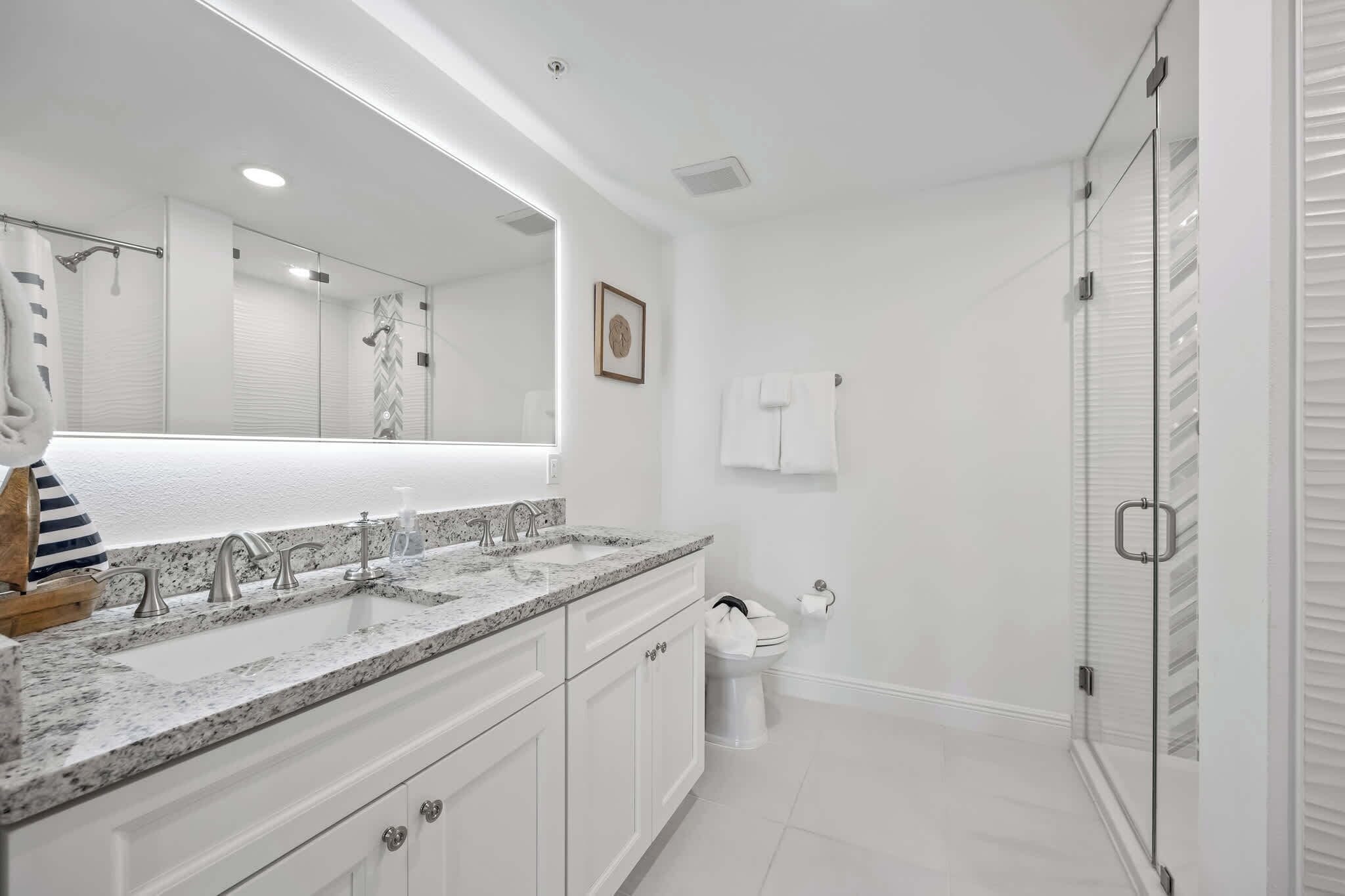 Shower, hair dryer, towels, shampoo