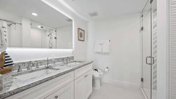 Shower, hair dryer, towels, shampoo
