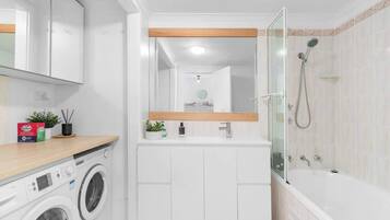 Shower, hair dryer, towels, soap