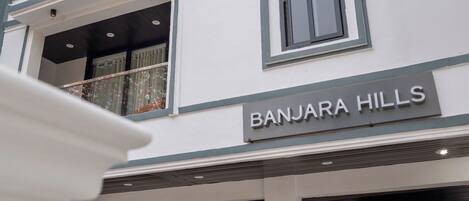 A multi-story building with a sign reading 'BANJARA HILLS'.