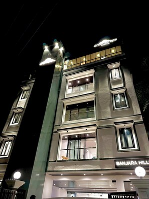A multi-story hotel with illuminated signage, including "Dreamscape Hotel" and "Banjara Hill." - Dreamscape by Fracspace (Hyderabad)