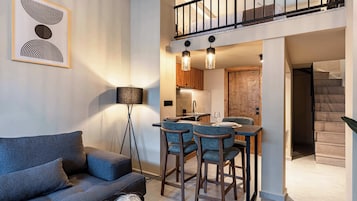 Deluxe Loft | Living area | Flat-screen TV