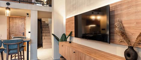 Deluxe Loft | Living area | Flat-screen TV