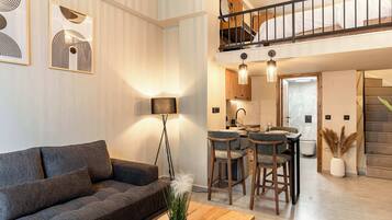 Deluxe Loft | Living area | Flat-screen TV