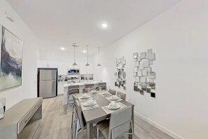 Share delicious moments in a spacious dining area with a bright and relaxing atmosphere.