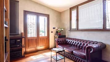 Suite Junior, vista piscina | Area soggiorno