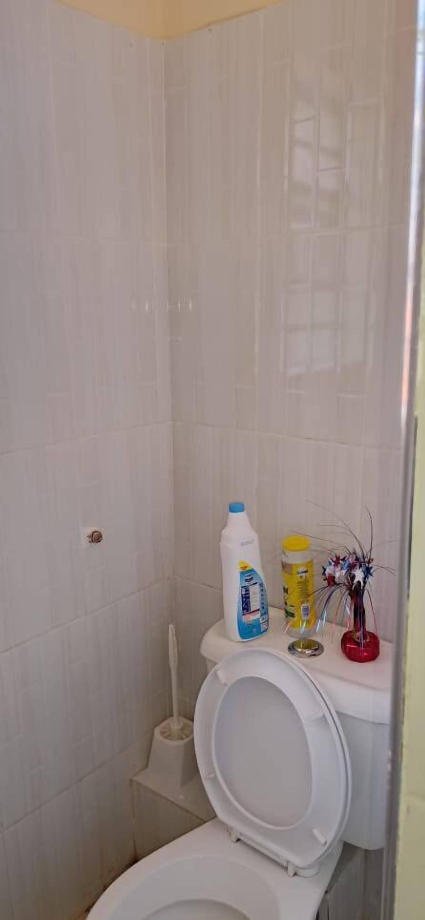 Shower, slippers, towels, soap