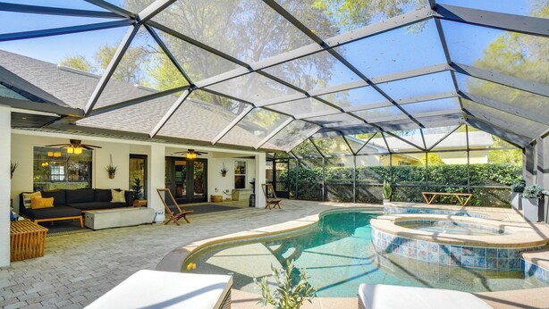 A covered outdoor area with a swimming pool, lounge chairs, and a seating area with cushions. - Near Parks & Lakes: Sorrento Home w/ Pool & Yard! (Sorrento)