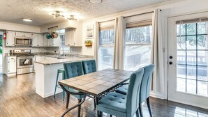 A kitchen with a central island, built-in oven, and stainless steel appliances. - 4 Mi to Wku: Hilltopper's Hideaway w/ Grills! (Bowling Green)