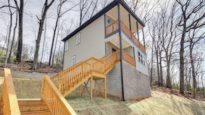 A two-story house with a wooden staircase leading to a balcony. - 6 Mi to Chattanooga: Home w/ Balcony & Dtwn Views! (Rossville)