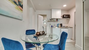 A modern kitchen with white cabinets, a microwave, and a coffee machine. - 2 Mi to Hard Rock Stadium: Studio in Miami Gardens (Miami Gardens)