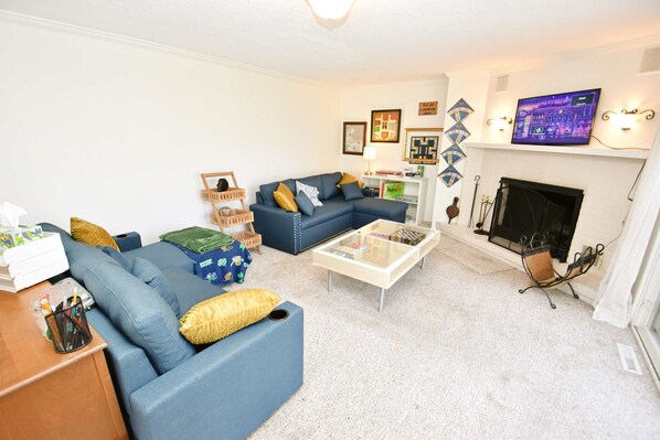 TV, fireplace, books, offices