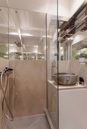 Shower, hair dryer, towels, soap