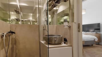 Exclusive Studio Suite | Bathroom | Shower, hair dryer, towels, soap