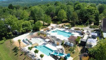 Seasonal outdoor pool, open 8:00 AM to 8:00 PM, pool umbrellas
