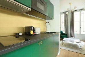 Fridge, microwave, stovetop, coffee/tea maker