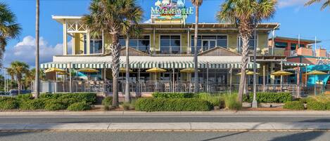 A building with a sign reading "Margaritaville" and a beachside location.