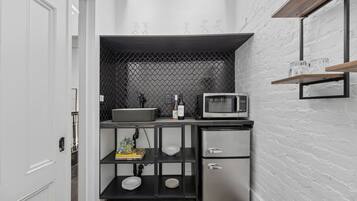 Microwave, stovetop, coffee/tea maker, cookware/dishes/utensils