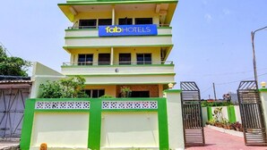 A multi-story building with a sign for "Bollywood 2.0" and "Fab Hotels". - DhamStay Hotel Asish Near Sea Beach Puri (Brahmagiri)