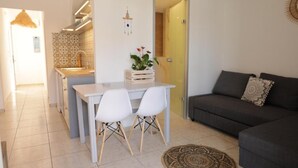 Deluxe Apartment, Pool View | Living area - Maria Apartments by Checkin (Hersonissos)
