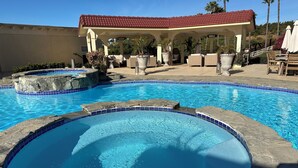 A swimming pool with a red-roofed pavilion and lounge chairs in the background. - Marvelous 11-bedroom villa in Escondido (Escondido)