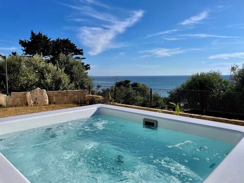 Sea view trullo with heated whirlpool