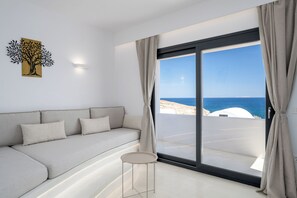Luxury Villa, Sea View | Living room | 50-inch Smart TV with satellite channels, fireplace - San Nectar Luxury Villas (Santorini)