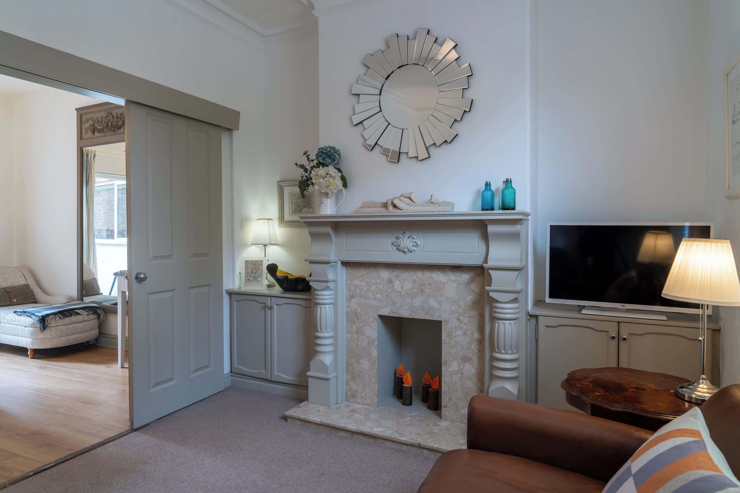 Relax in the lounge with a classic fireplace, tasteful décor, and easy flow through to the dining area – perfect for quiet evenings or catching up on your favourite shows.
