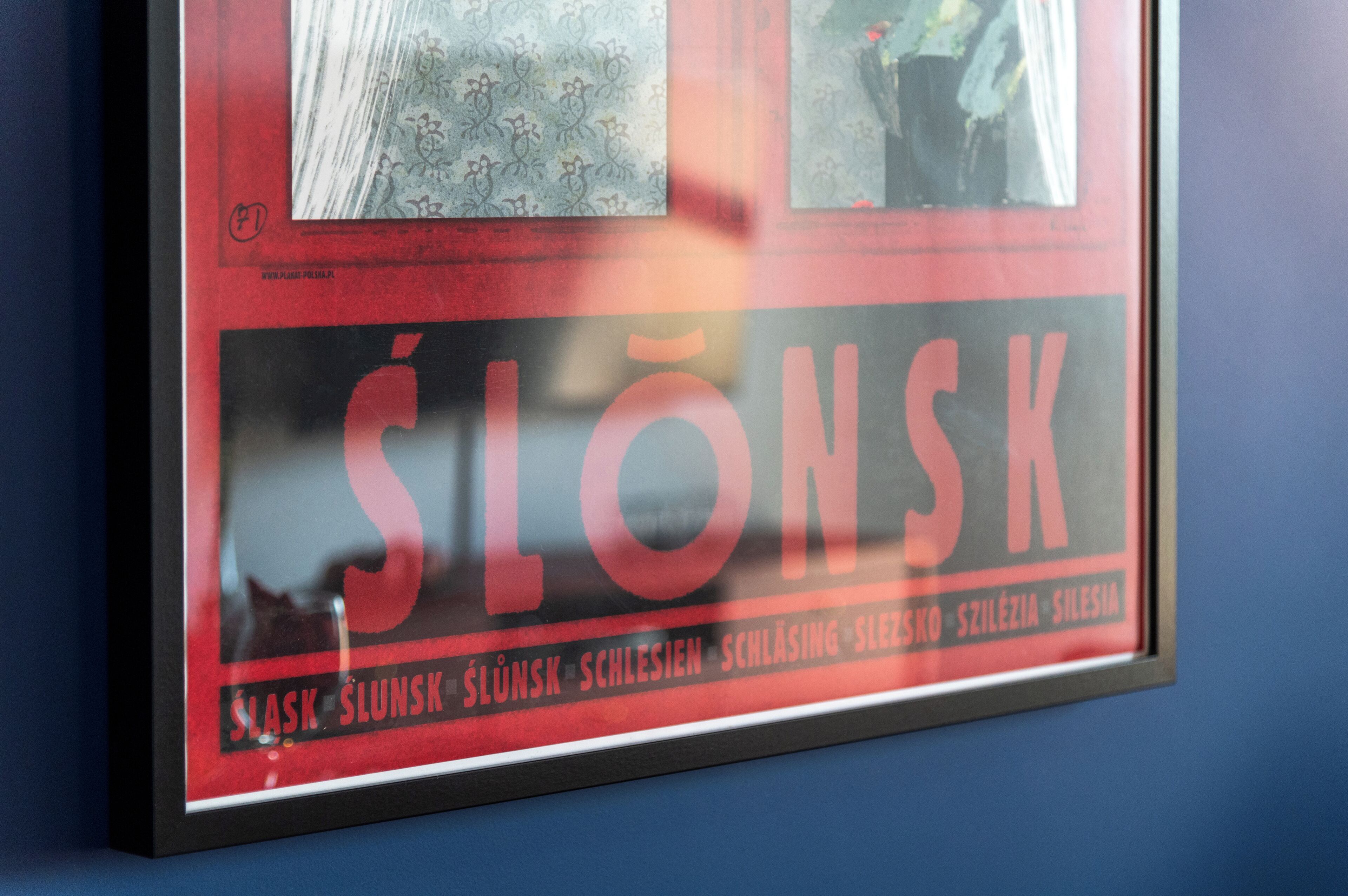 A framed poster with the word "SLONSK" prominently displayed.