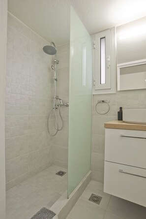 Shower, hair dryer, towels, soap