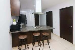 Fridge, microwave, stovetop, coffee/tea maker