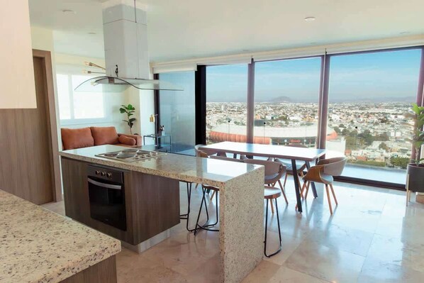 Fridge, stovetop, coffee/tea maker, cookware/dishes/utensils