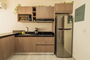 Fridge, stovetop, coffee/tea maker, cookware/dishes/utensils