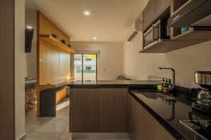 Fridge, stovetop, coffee/tea maker, cookware/dishes/utensils