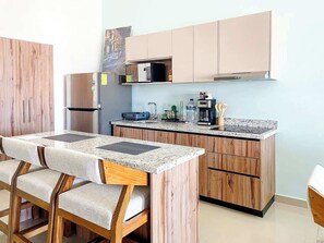 Fridge, microwave, stovetop, coffee/tea maker