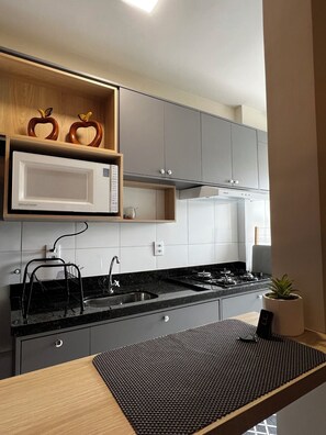 Fridge, microwave, stovetop, coffee/tea maker