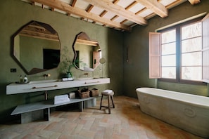 Deluxe Superior | Bathroom | Hair dryer, towels, soap, shampoo