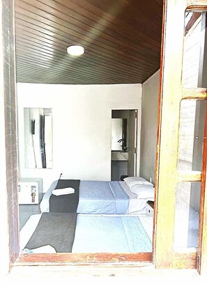 Basic Quadruple Room | Bathroom | Shower, towels, soap, toilet paper