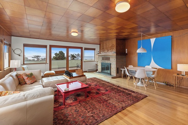 Open plan living room, dining room, kitchen.  Fireplace doesn't function.