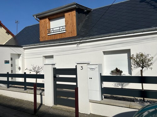 House near the sea with land