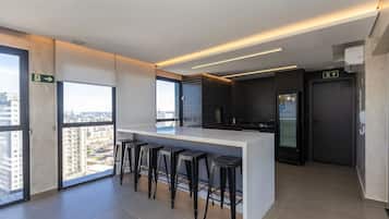 Full-size fridge, microwave, cookware/dishes/utensils