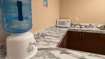 Fridge, microwave, stovetop, coffee/tea maker