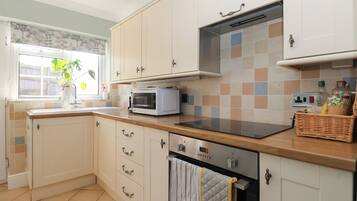 Fridge, microwave, toaster, cookware/dishes/utensils