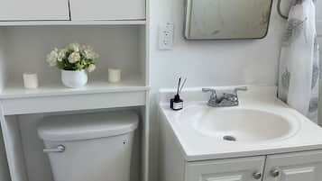 Shower, hair dryer, towels, shampoo