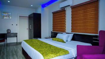 Deluxe Room, Balcony, City View | Desk, laptop workspace, blackout drapes, soundproofing